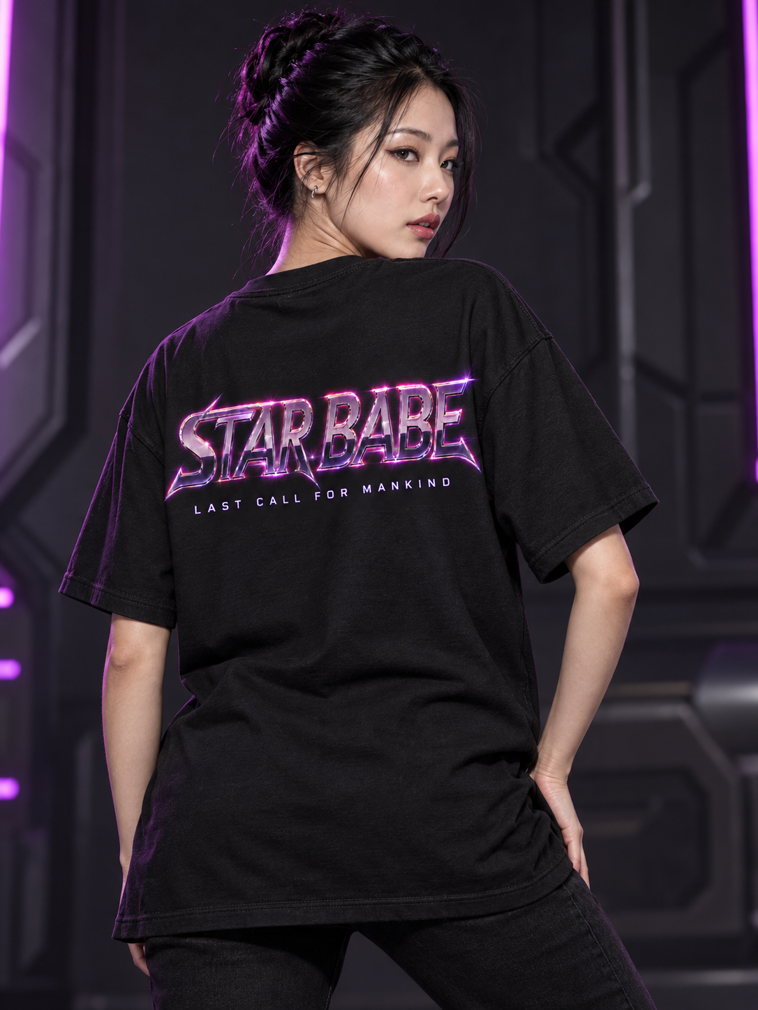 Model showing the back of an oversized black T-shirt with the Star Babe chrome logo and Last call for mankind